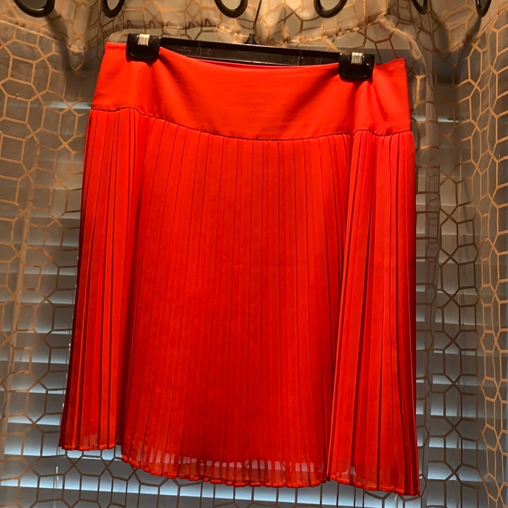 Orange pleated skirt
